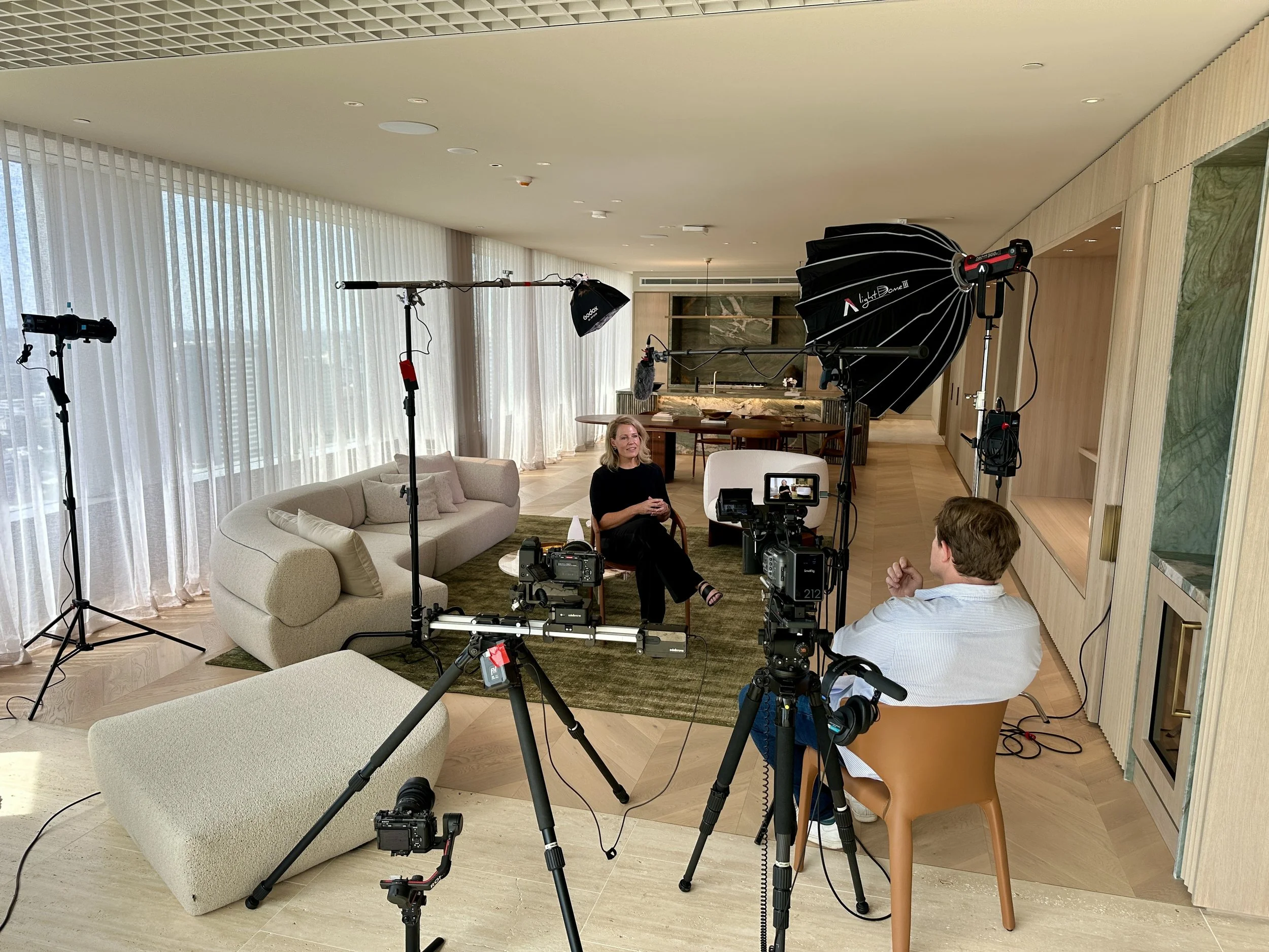 Corporate video production setup in Sydney with lighting, camera and interview filming environment
