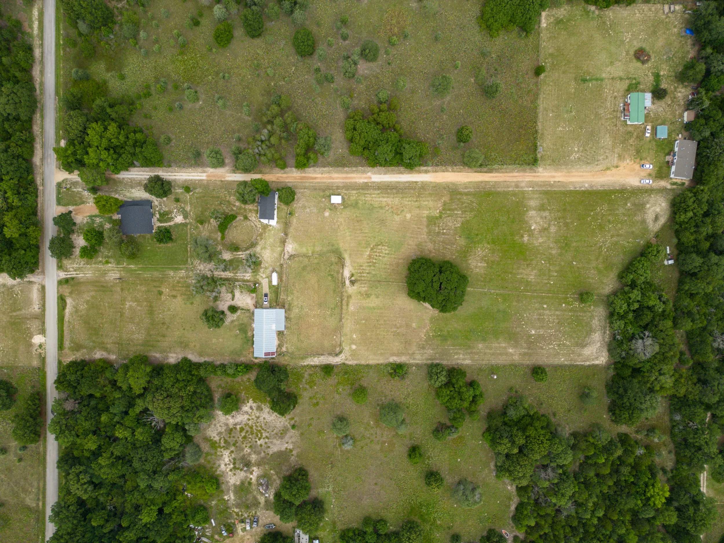 [Direct overhead view of eight-acre property, zoomed out.]