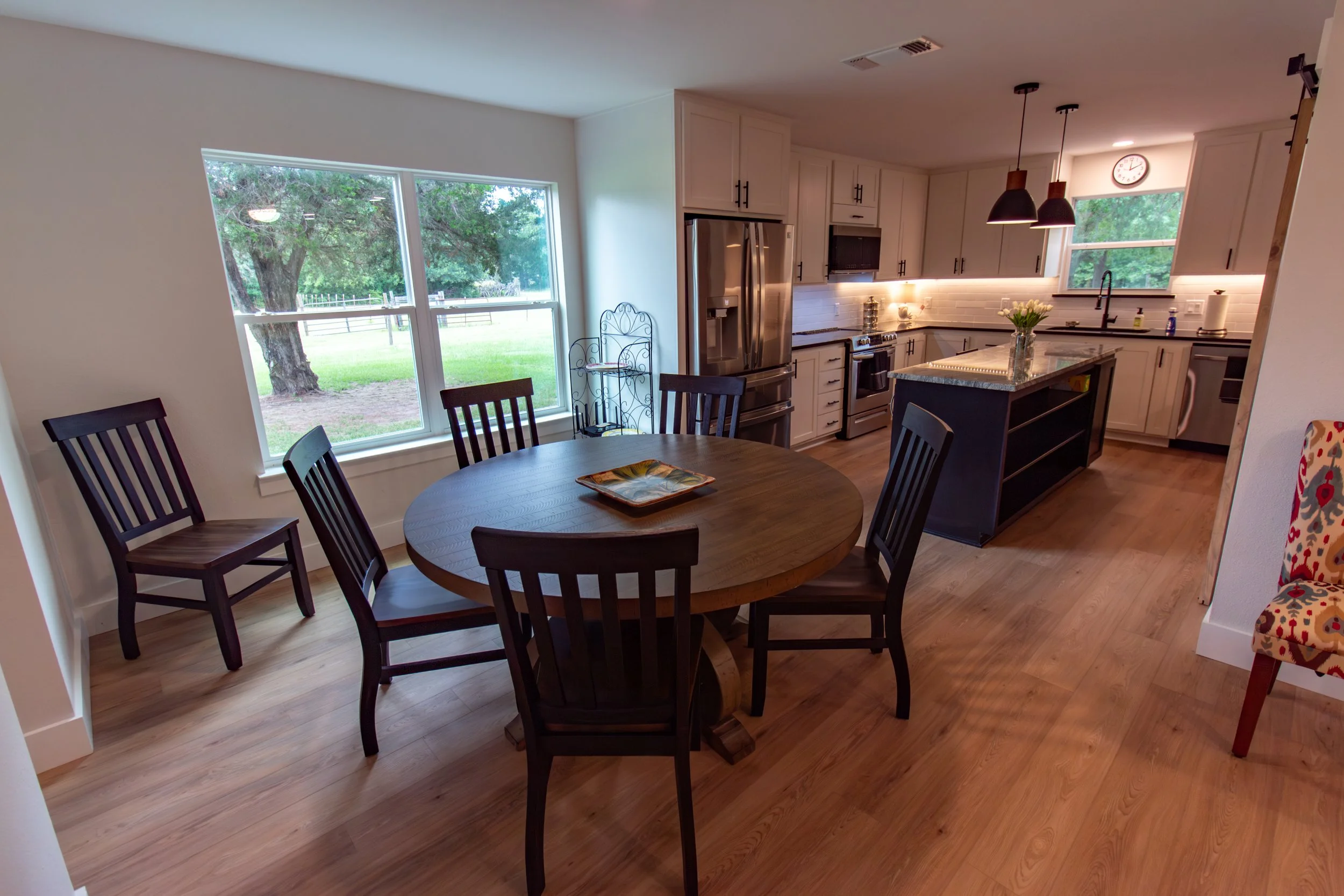 [Breakfast nook and kitchen, from living room.]