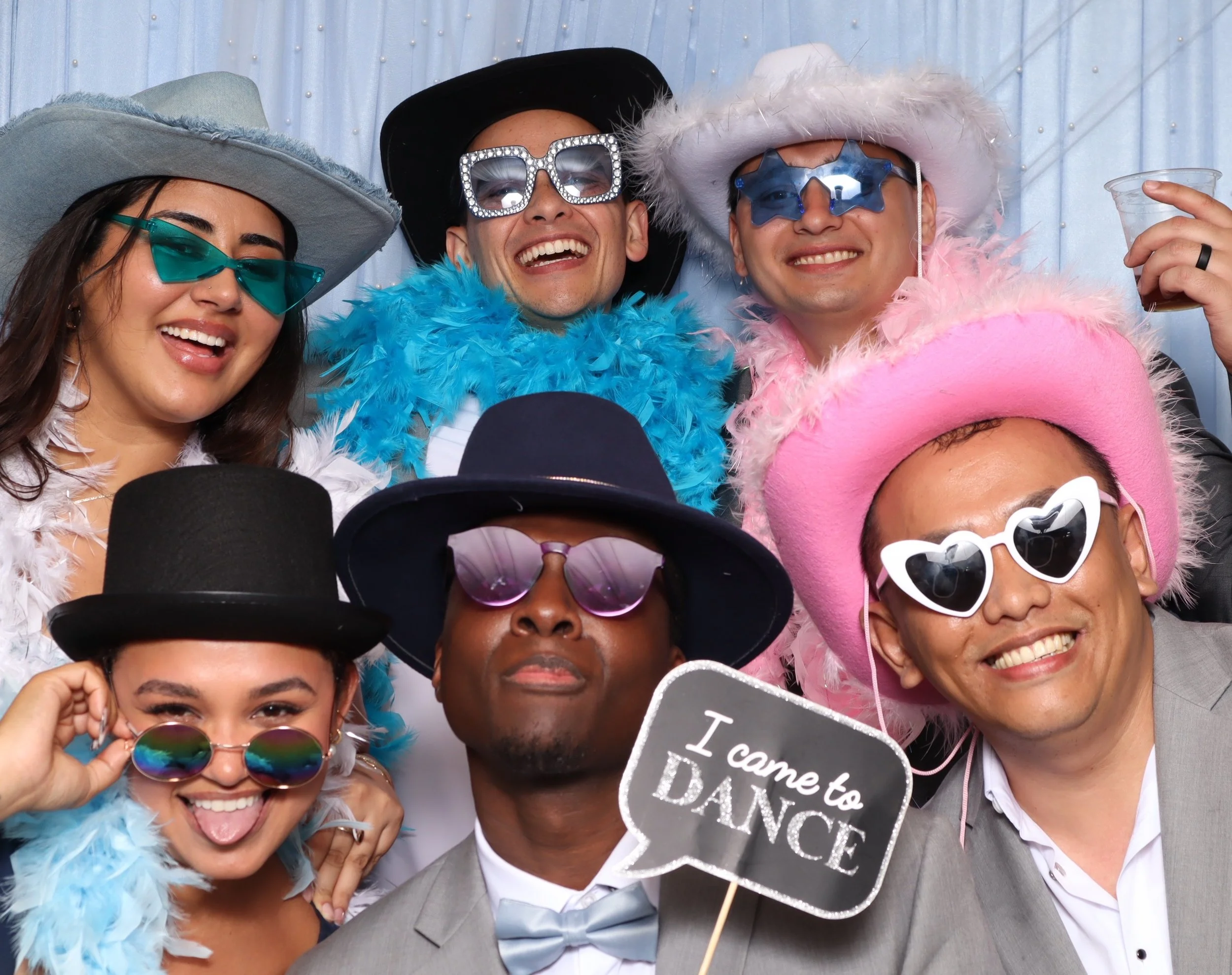 Premium Props Including Hats, Glasses, Boas and Signs for a Wedding