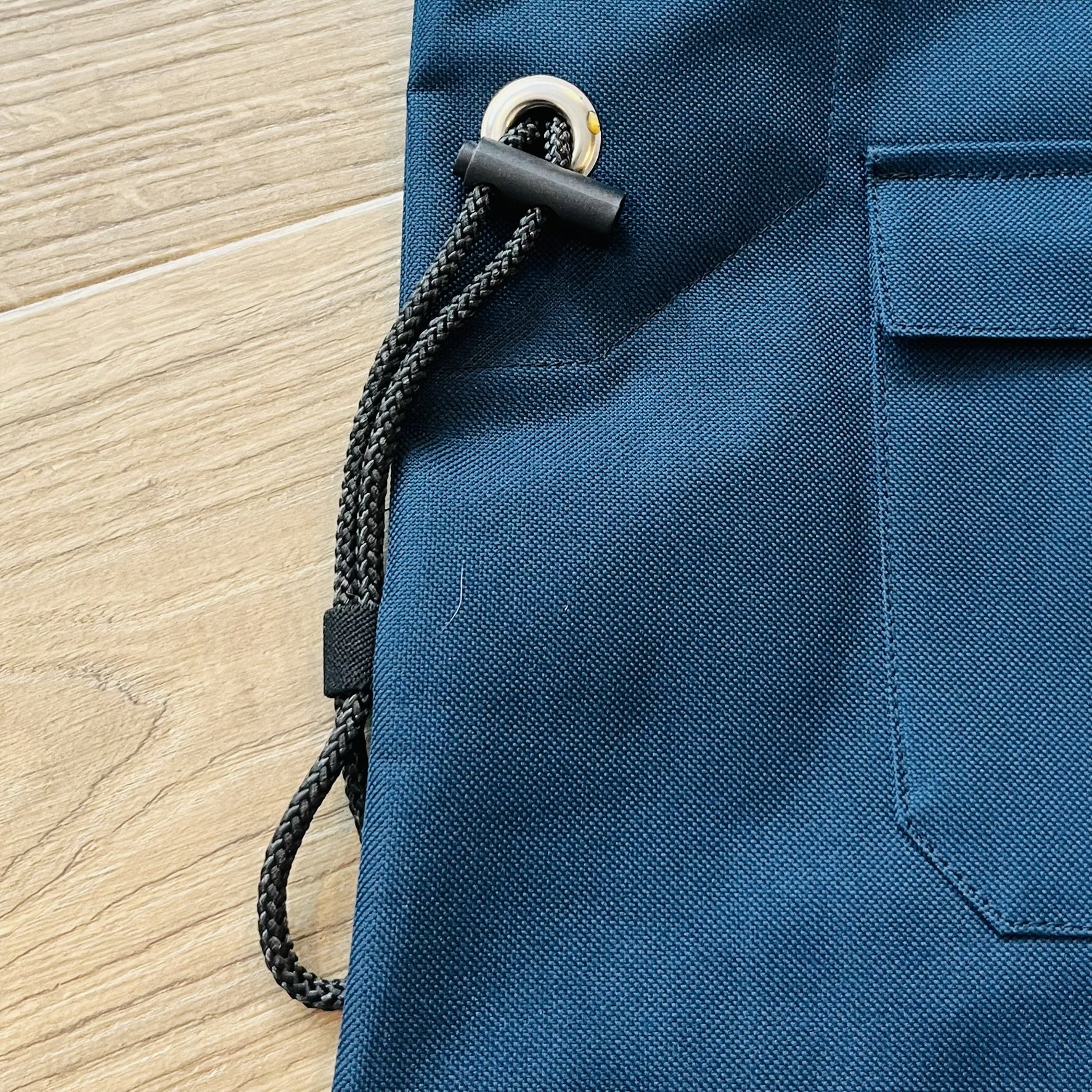 Rear cinch cord holds smaller items on the outside of the bag...