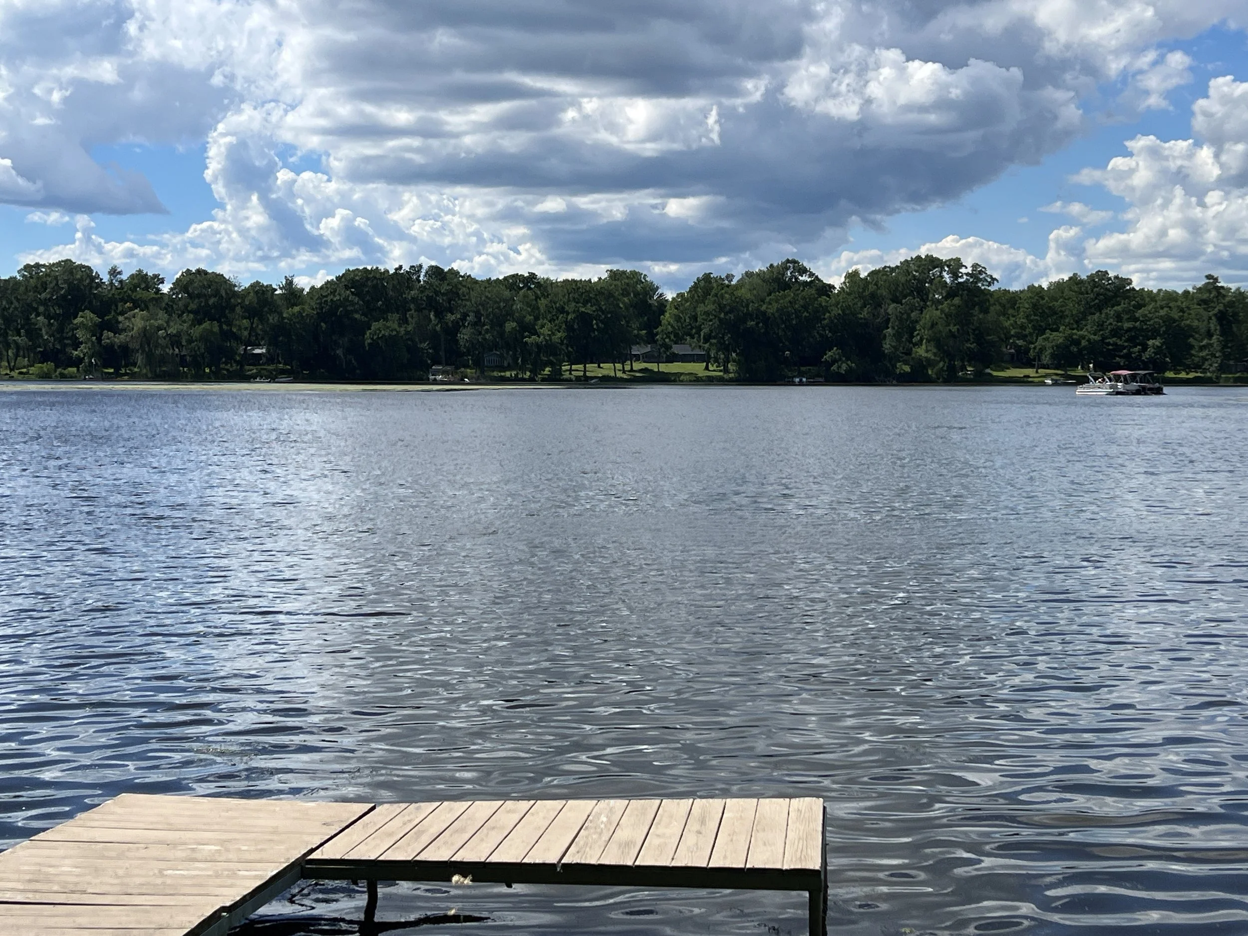 A dock on the lazy lake in Fall River Wisconsin on a Summer day