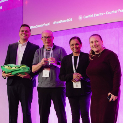Photo - winner receiving a trophy at the Public Counter Fraud Awards