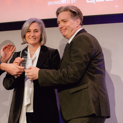 Photo - winner receiving a trophy at the Public Counter Fraud Awards