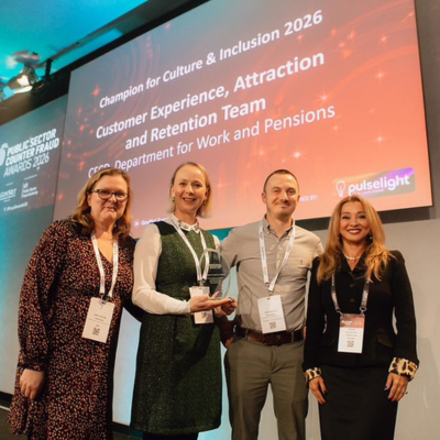 Photo - winner receiving a trophy at the Public Counter Fraud Awards