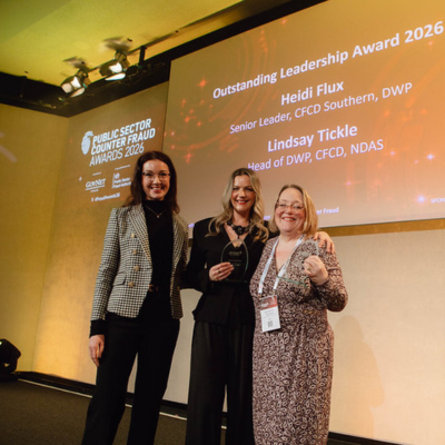 Photo - winner receiving a trophy at the Public Counter Fraud Awards