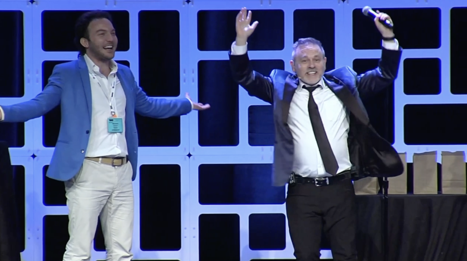 Audience members actively participating in Joshua Seth’s keynote speech about human connection in the age of AI