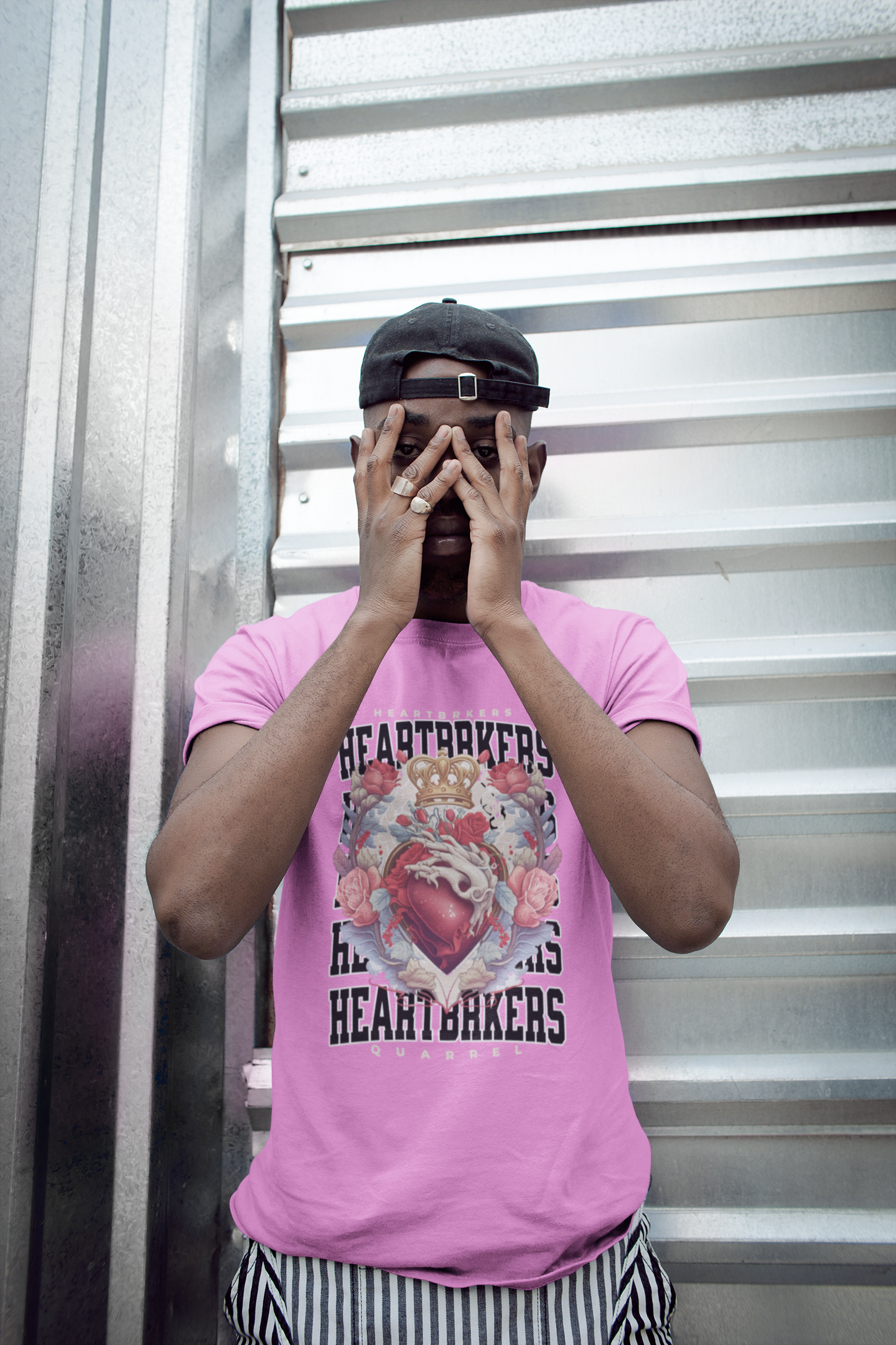 t-shirt-mockup-of-a-man-hiding-his-face-against-a-metal-door-21683.png