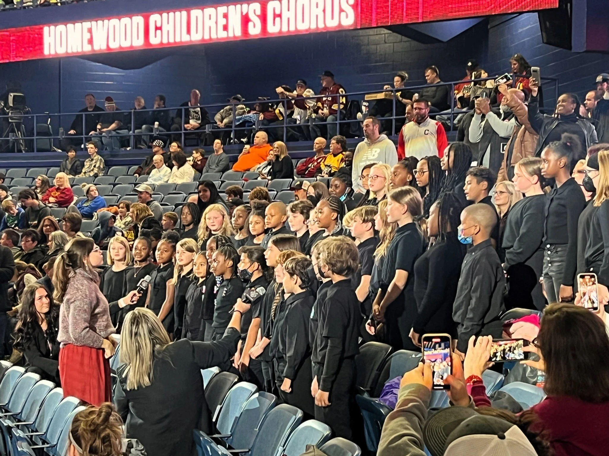Churchill’s Homewood Children’s Chorus performing at a Chicago Wolves hockey game.