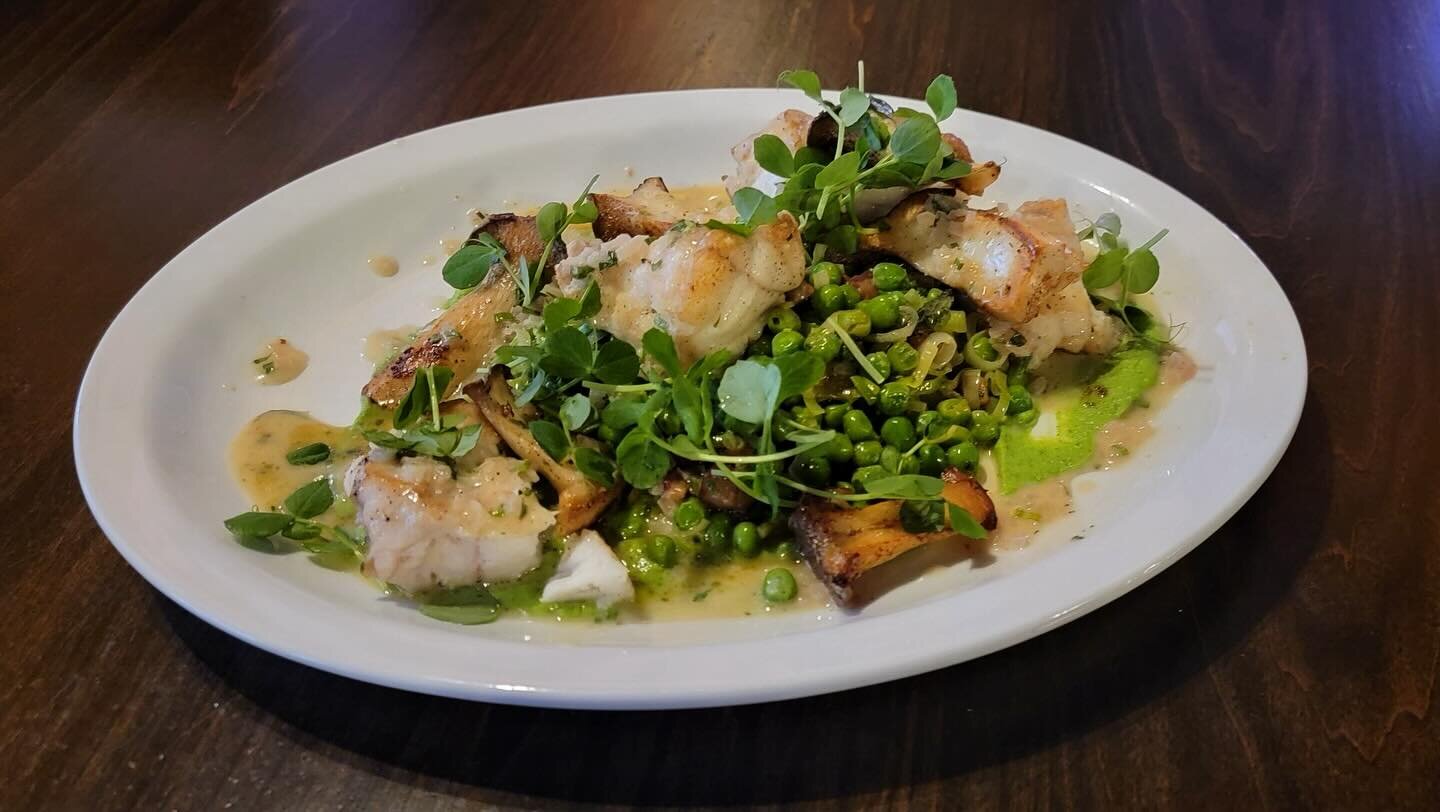 One of our specials this weekend!

Monkfish, saut&eacute;ed peas, king trumpet mushrooms, leeks with pancetta and mint, pickled shallot, and tarragon buerre blanc. 
These tend to sell out fast- brave the rain and try this amazing dish! 
#frenchfood #