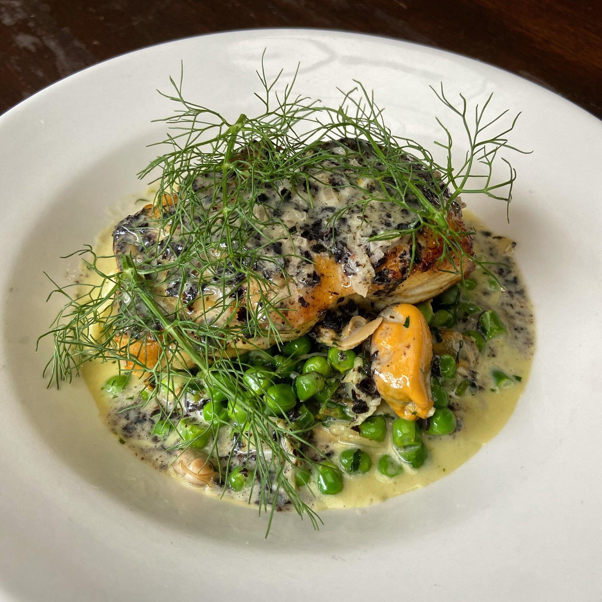 Le Poisson du March&eacute;- halibut with a nori beurre blanc, mussels, clams, peas, and asparagus! 
Tested and approved by the staff. 
#poissondumarch&eacute; #frenchfood #frenchcomfortfood #avleats #ashevillerestaurant #avlbouchon #eatlocal