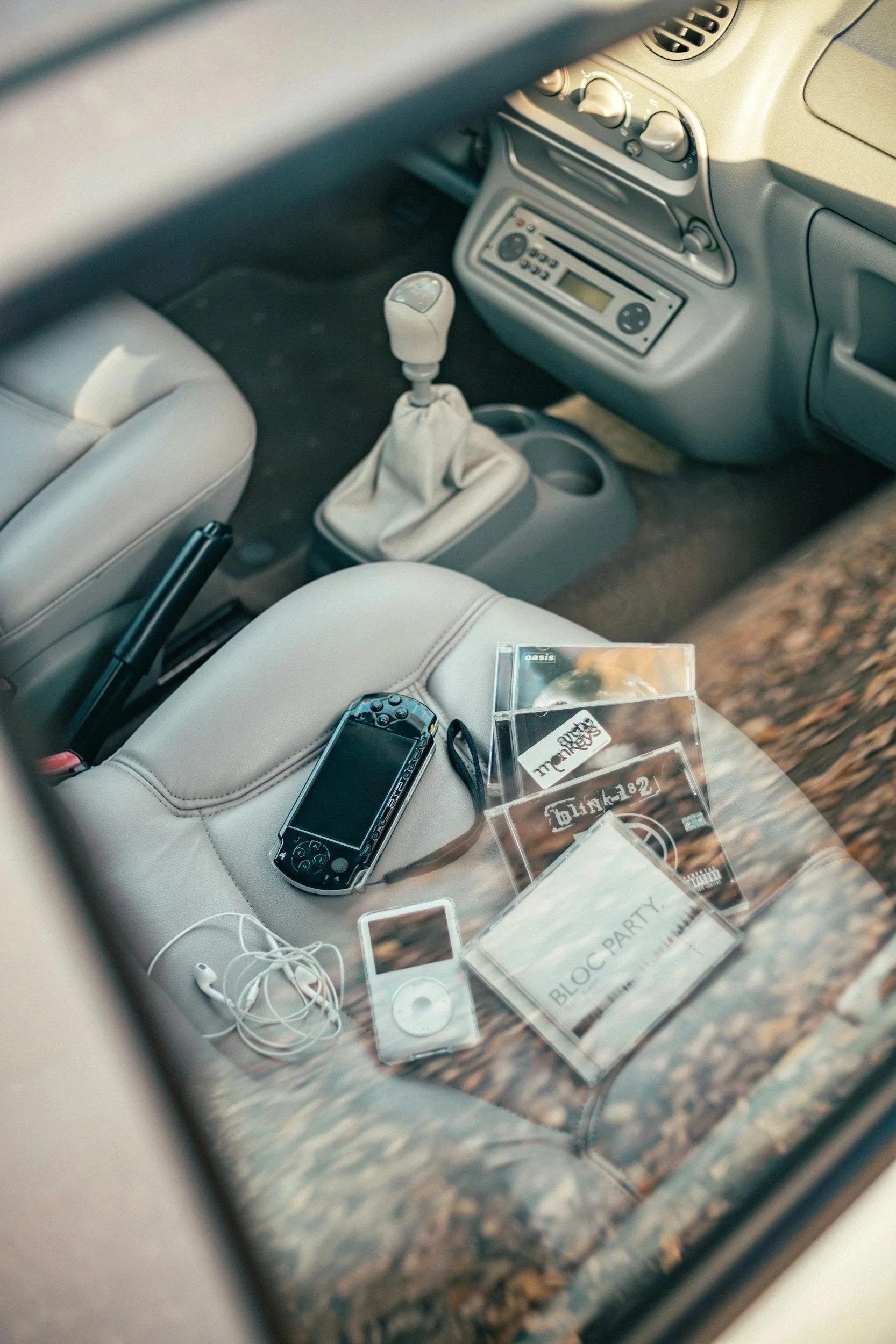 clutter on front seat of car