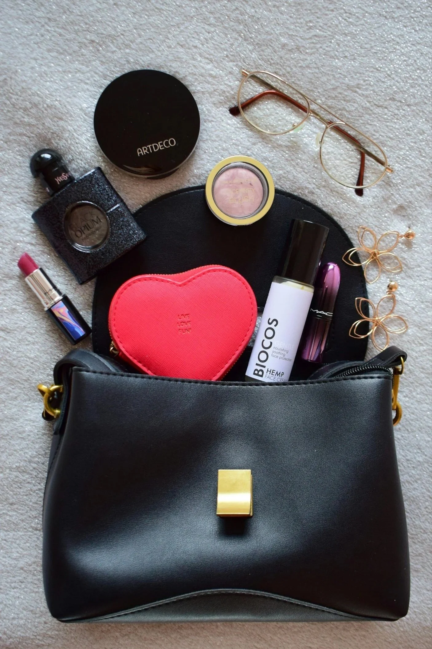 contents of black purse strewn