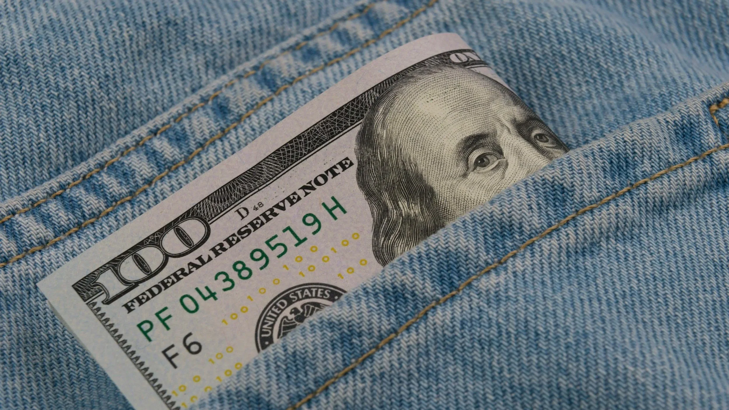 hundred-dollar bill in jean pocket