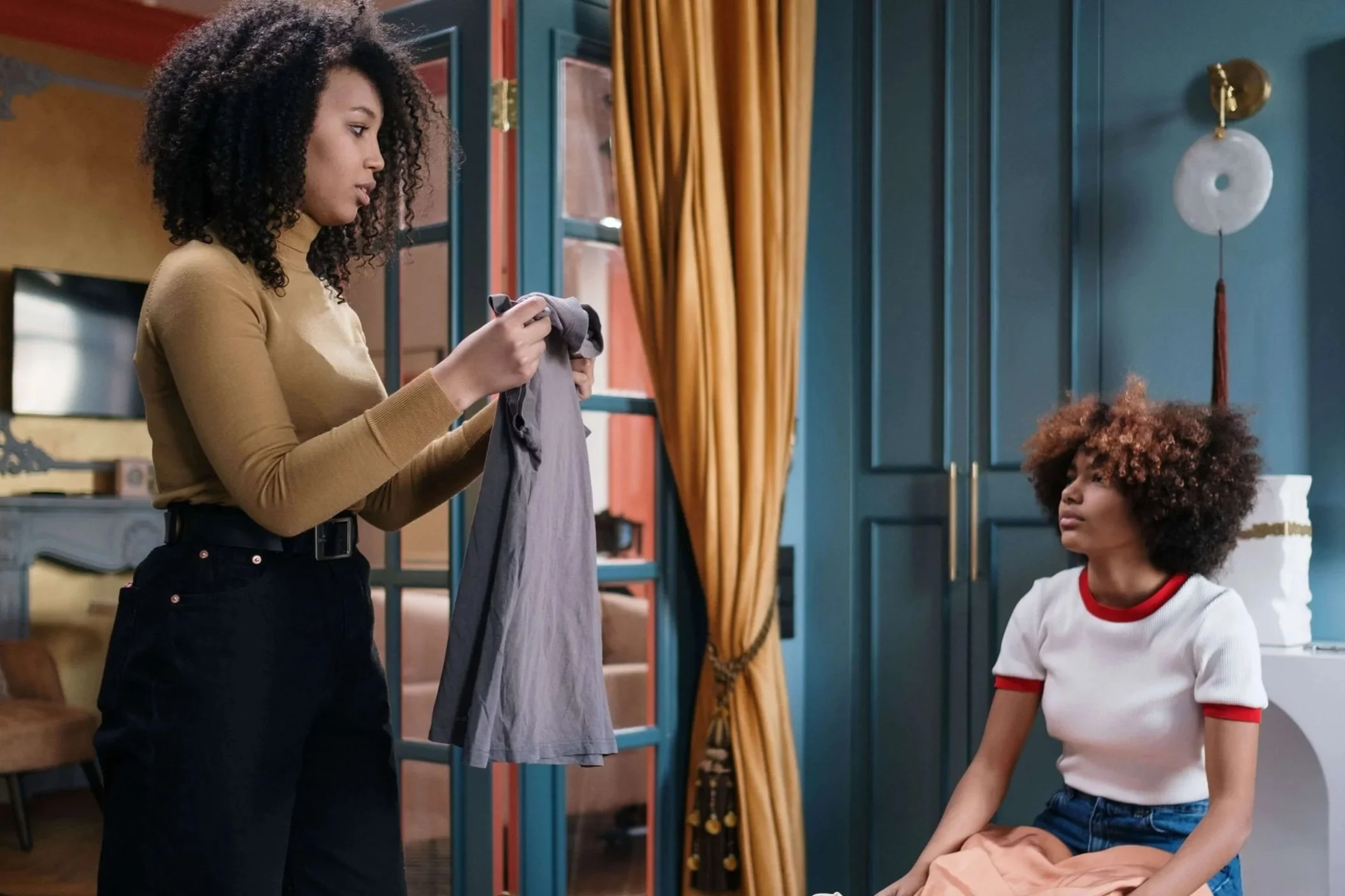 two women deciding what to declutter