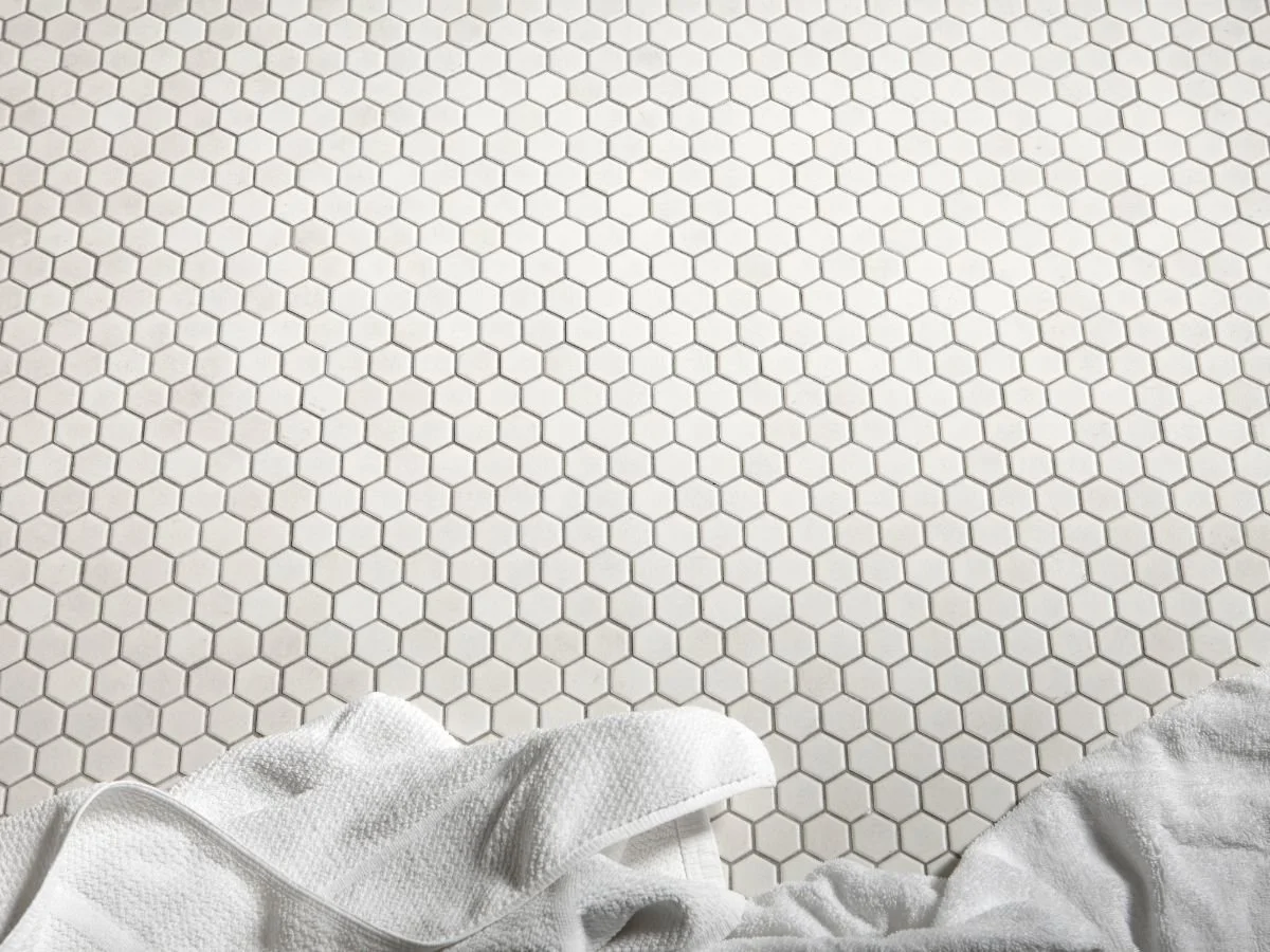 Non-slip flooring tile in a senior bathroom with a towel