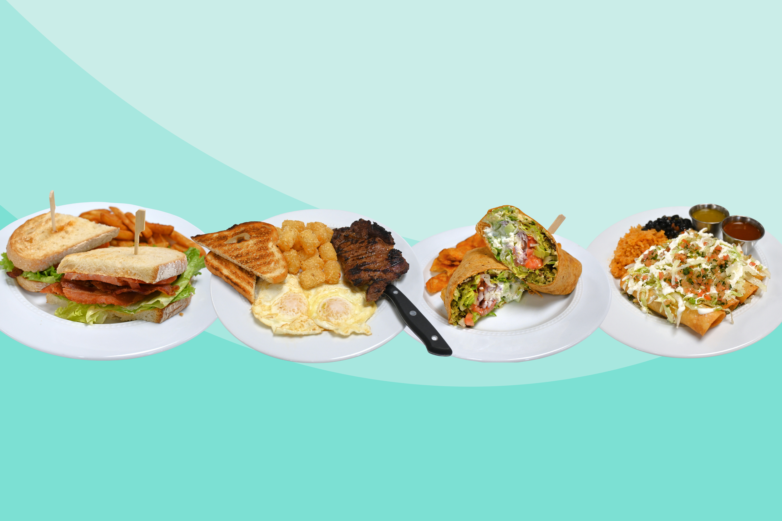 Four plates of delicious-looking food sit against a pale turquoise background