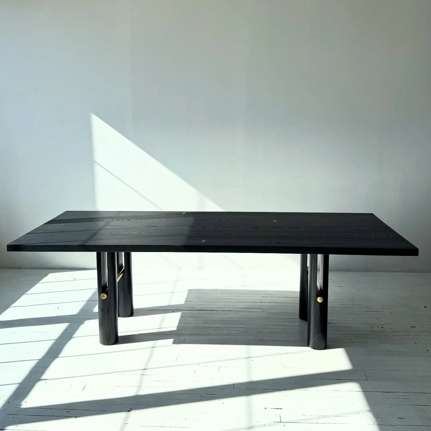Our LOUP dining table at our Williamsburg studio in New York. Available in any of our woods and finishes.