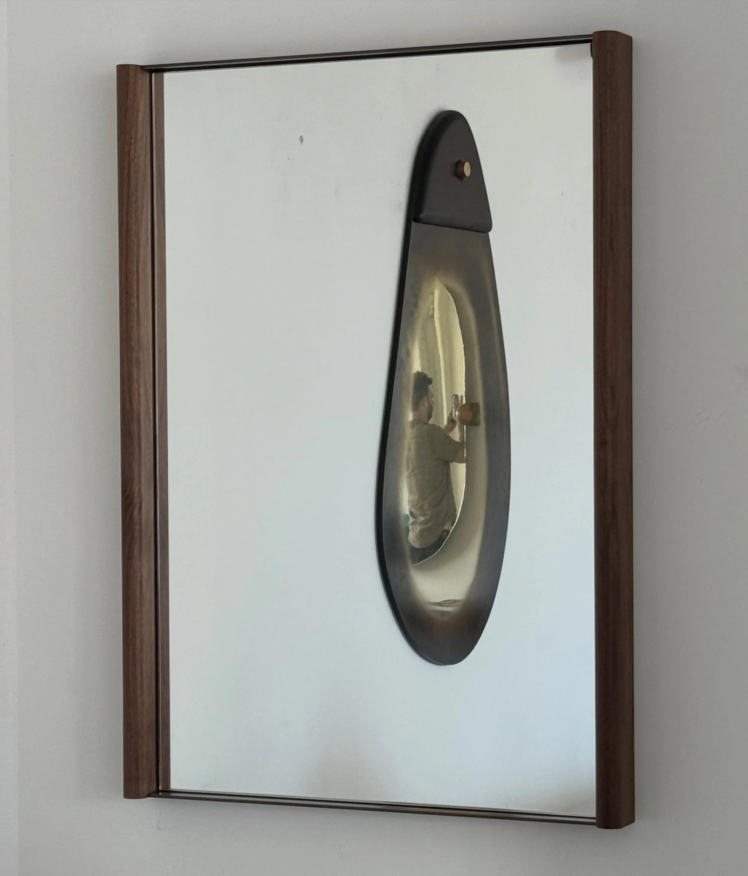 After receiving multiple request for a smaller version of our Desmond mirror, we are happy to introduce an our Desmond wall mount mirror. Custom sizing available. #mirror #madeinny #walnut #brass