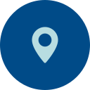 A blue map pin icon on a dark blue circular background