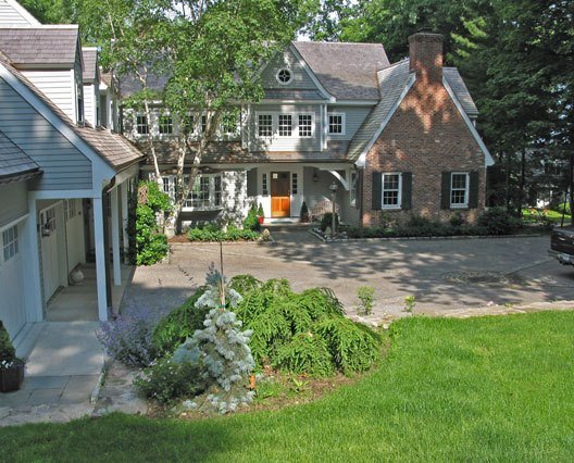 Installation of driveway stone wall and foundation plantings.jpg