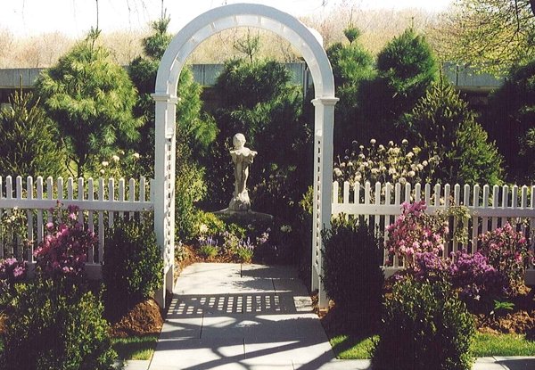 Fence installation to enhance garden focal point.