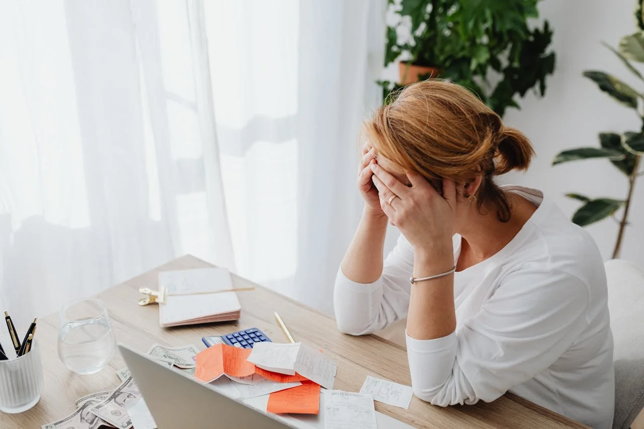 woman-and-receipts-on-desk