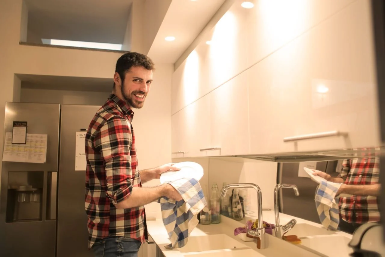 man-wiping-the-dish-plates-clean