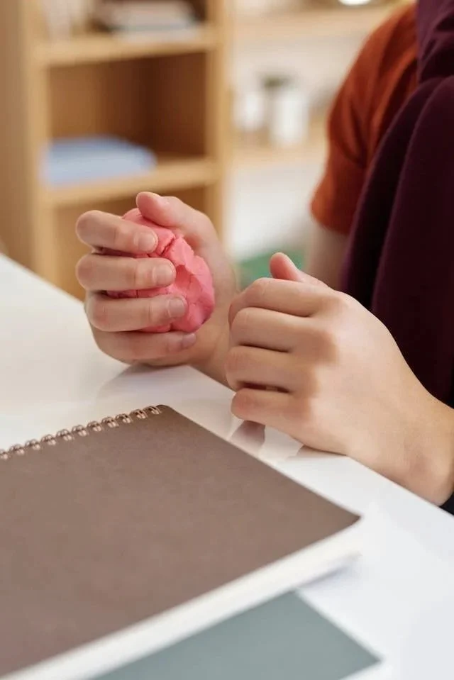 young child playing with playdough