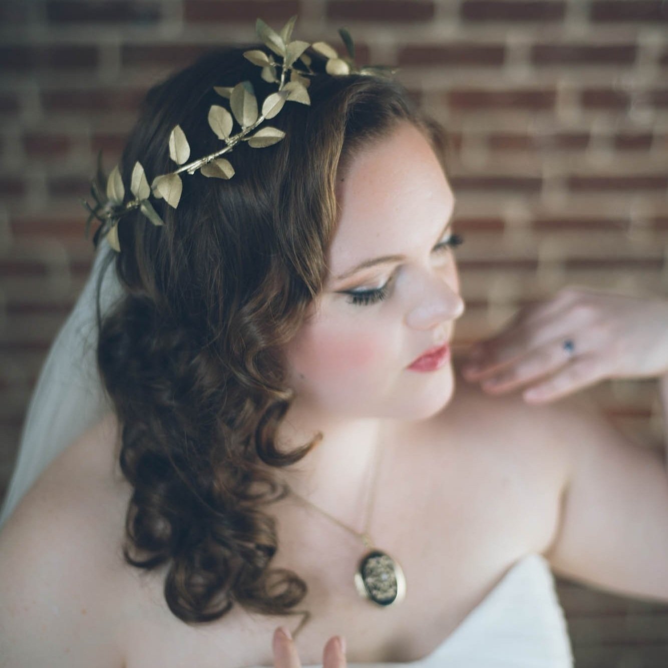 upclose portrait of bride wearing leafy crown and necklace taken by Sharma Shari Photography