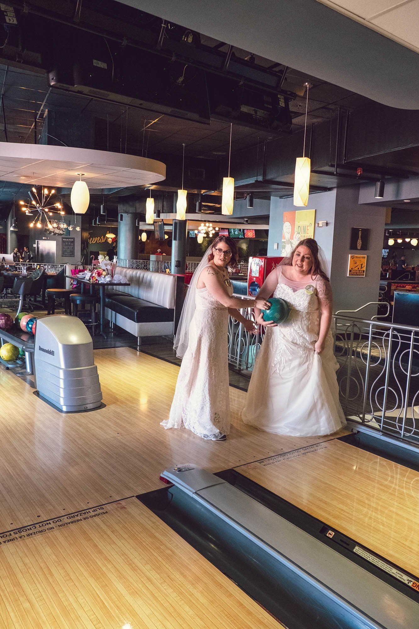 queer newlyweds bowl after elopement taken by Sharma Shari Photography