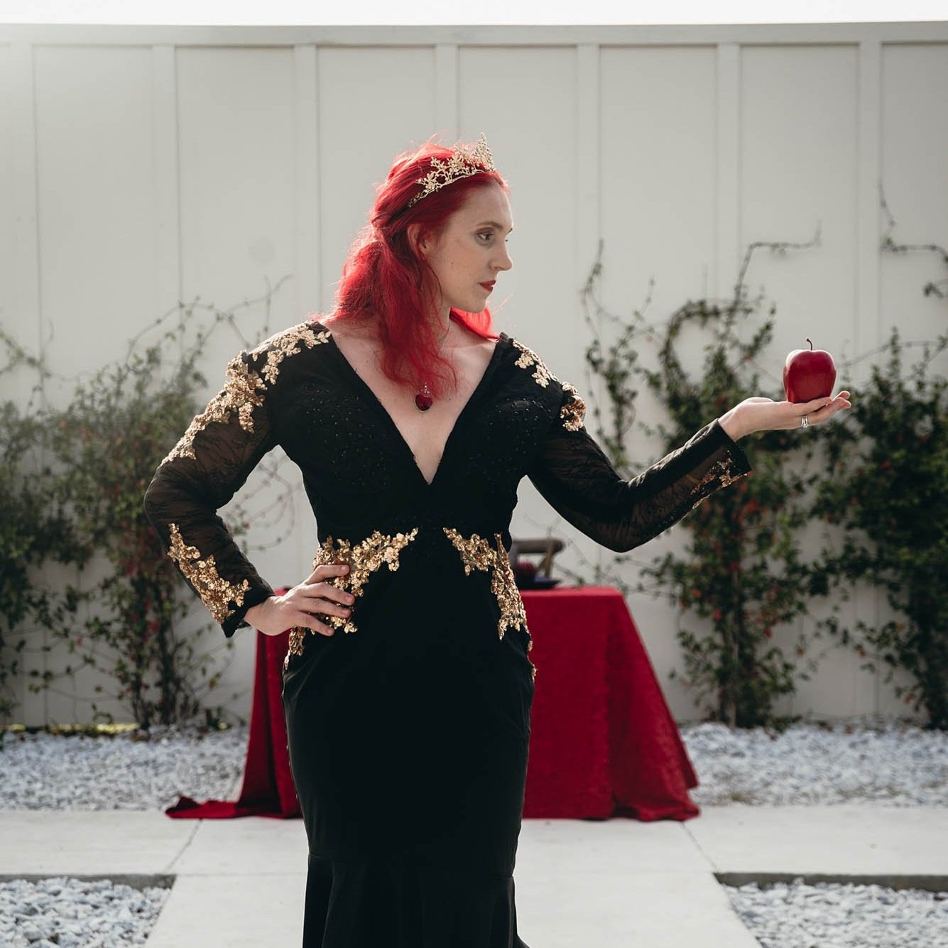 portrait of snow white cosplay holding an apple taken and edited by Sharma Shari Photography