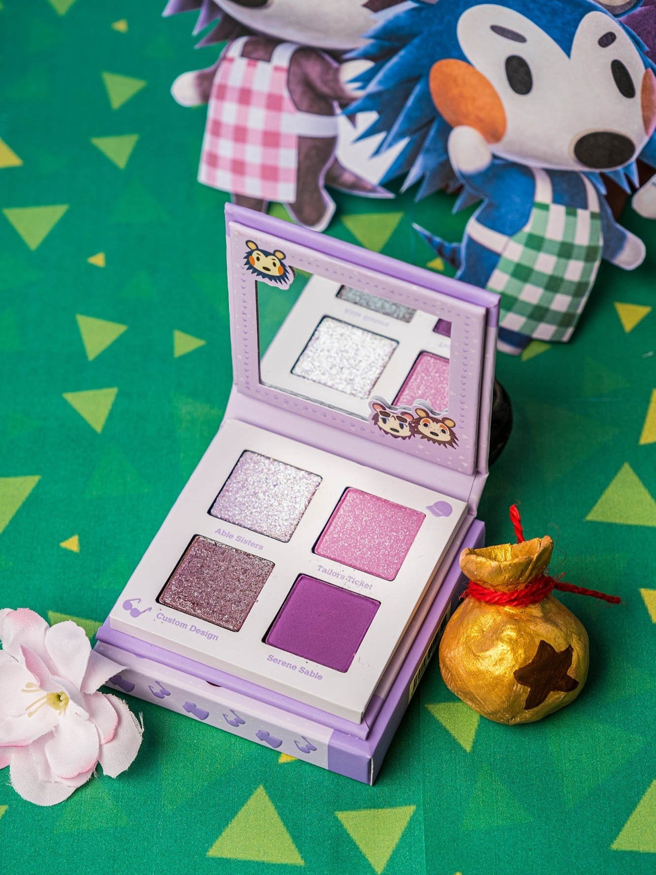 Professional product photography of Animal crossing makeup palette on green background taken by Sharma Shari Photography