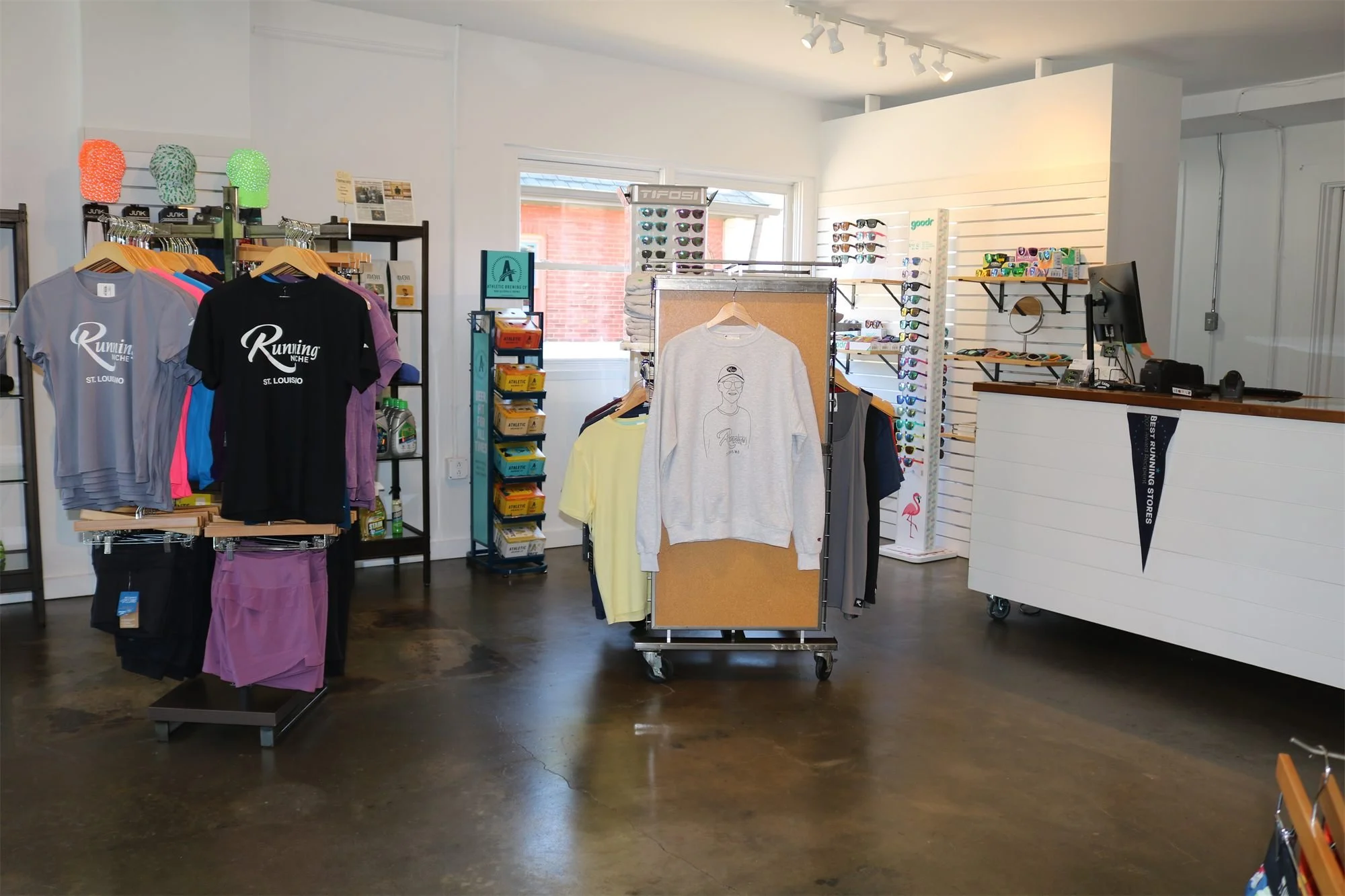 Checkout counter and apparel corner inside Running Niche, 1601 Tower Grove Ave, St. Louis