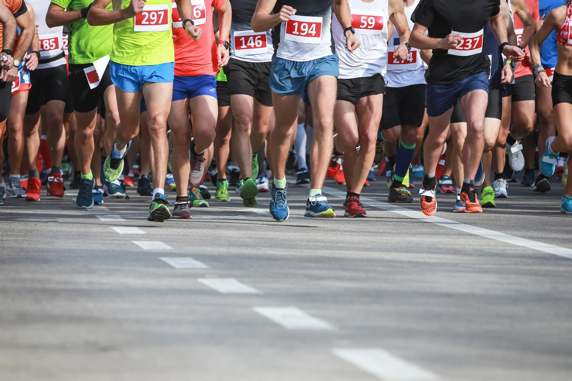 Runners at the start line of a local tune-up race