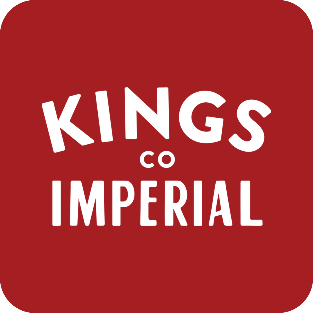 Red background with white text that reads 'Kings Co Imperial' in playful, varying font sizes.