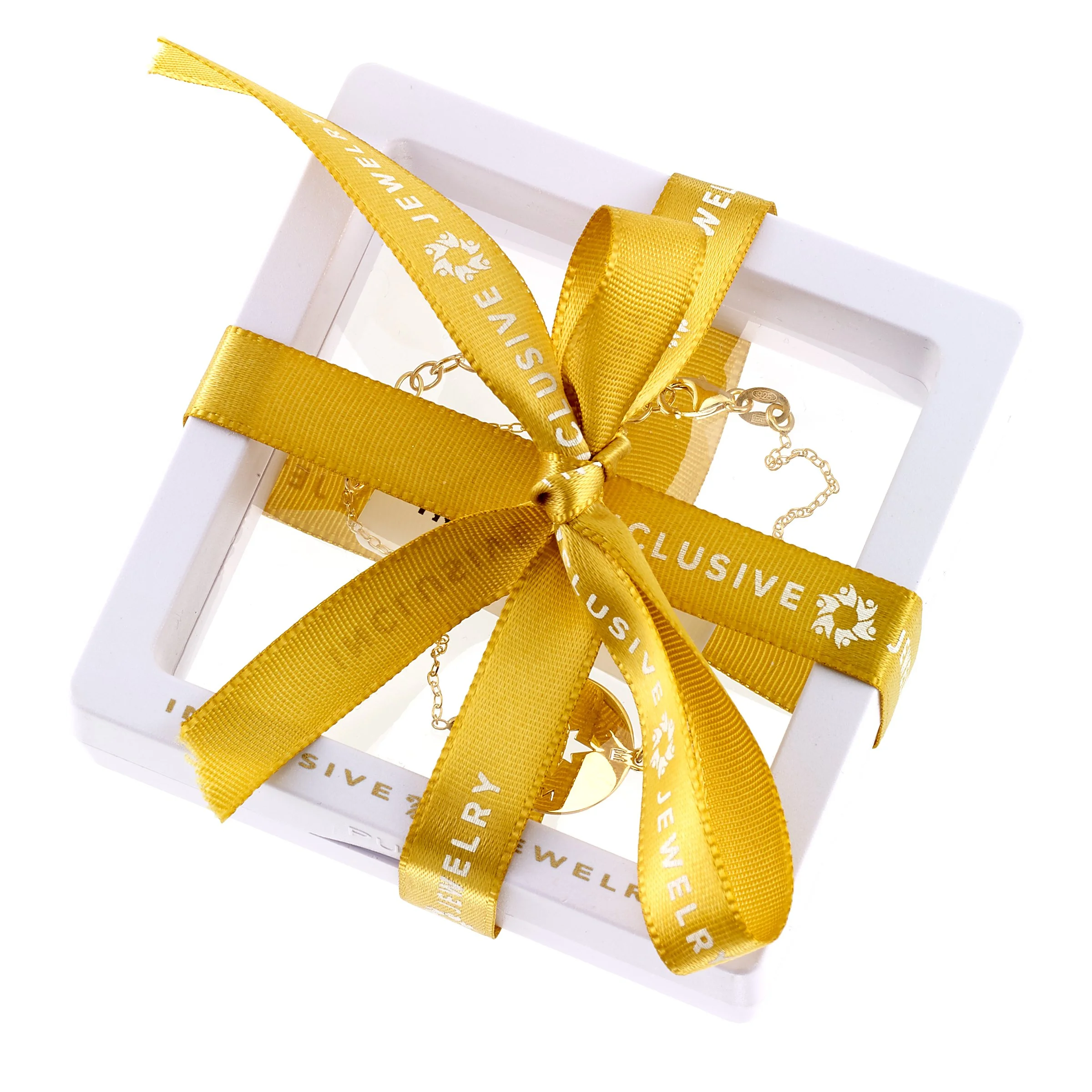 Jewelry box wrapped with a yellow ribbon that says 'CLUSEWE 17', containing a necklace visible inside.