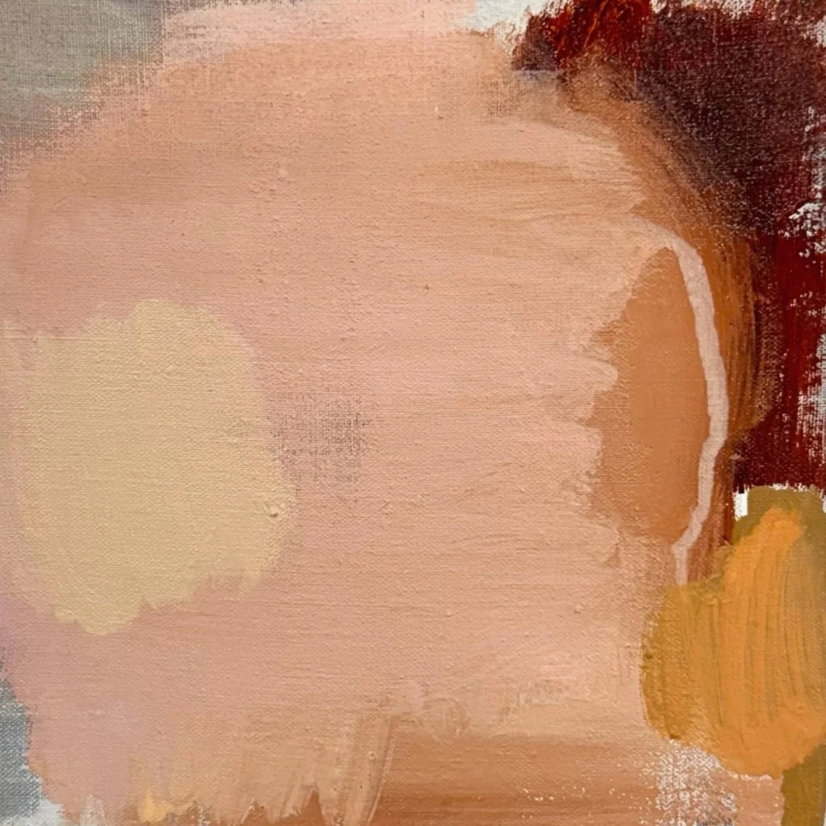 Close-up of a textured abstract painting with warm earthy tones and brushstrokes.