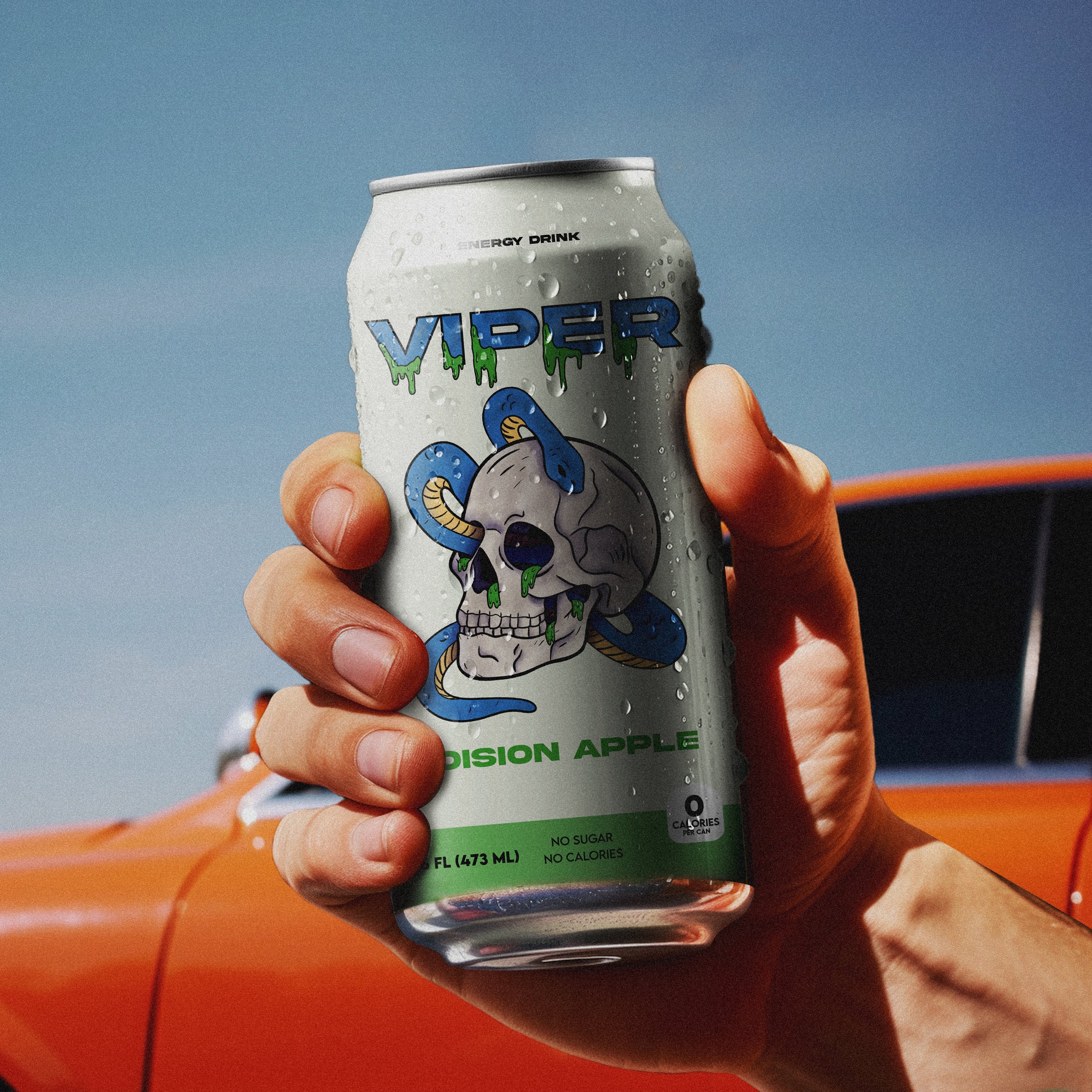 Hand holding a can of Viper Poison Apple energy drink with a graphic skull and snake design, against a bright blue sky and an orange car in the background.