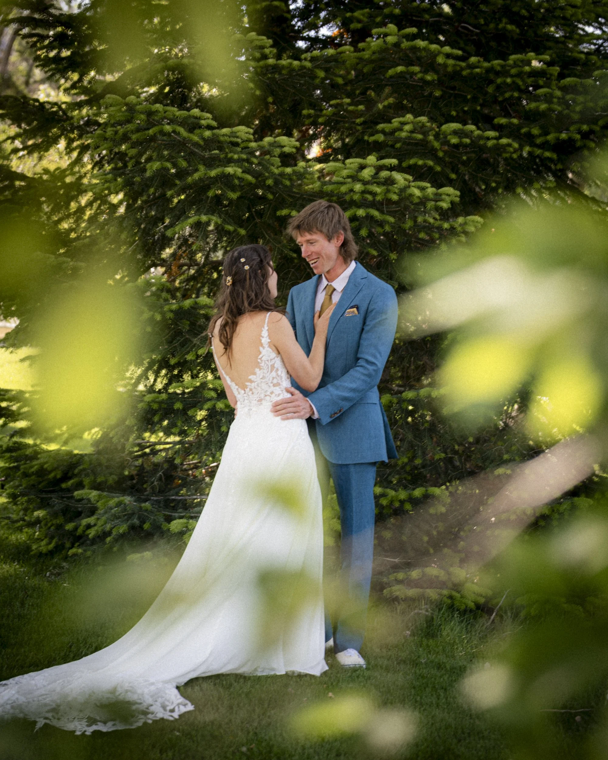 smiling bride in the woods by Lee Vining 