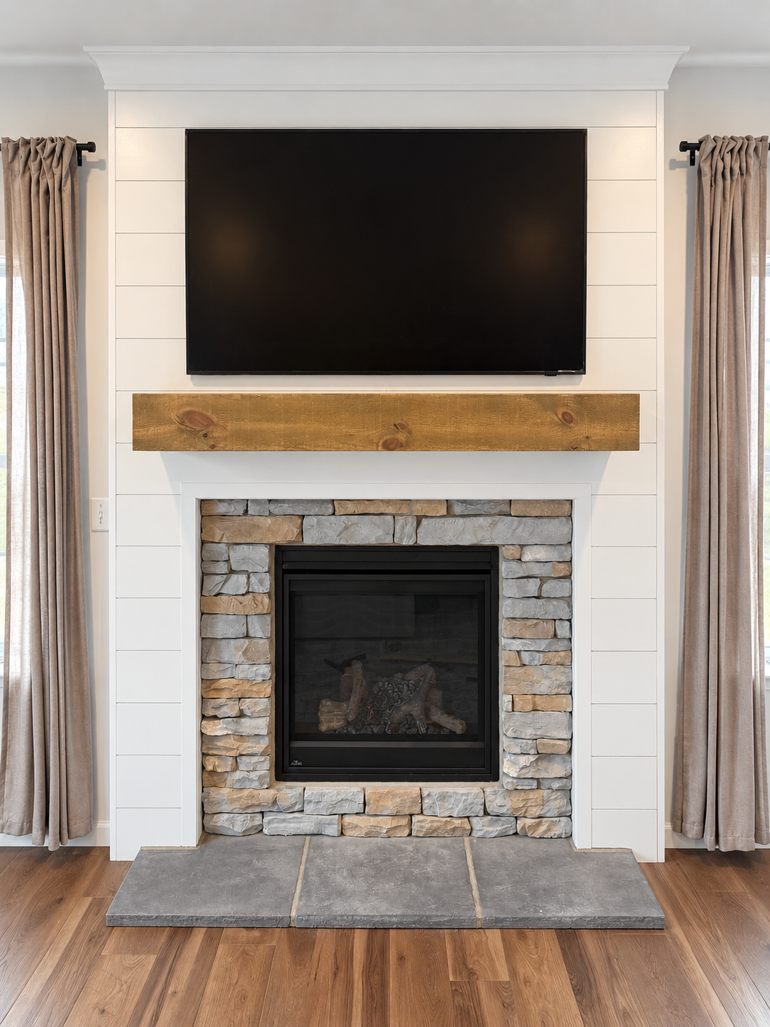 Completed fireplace and television feature wall with custom trim