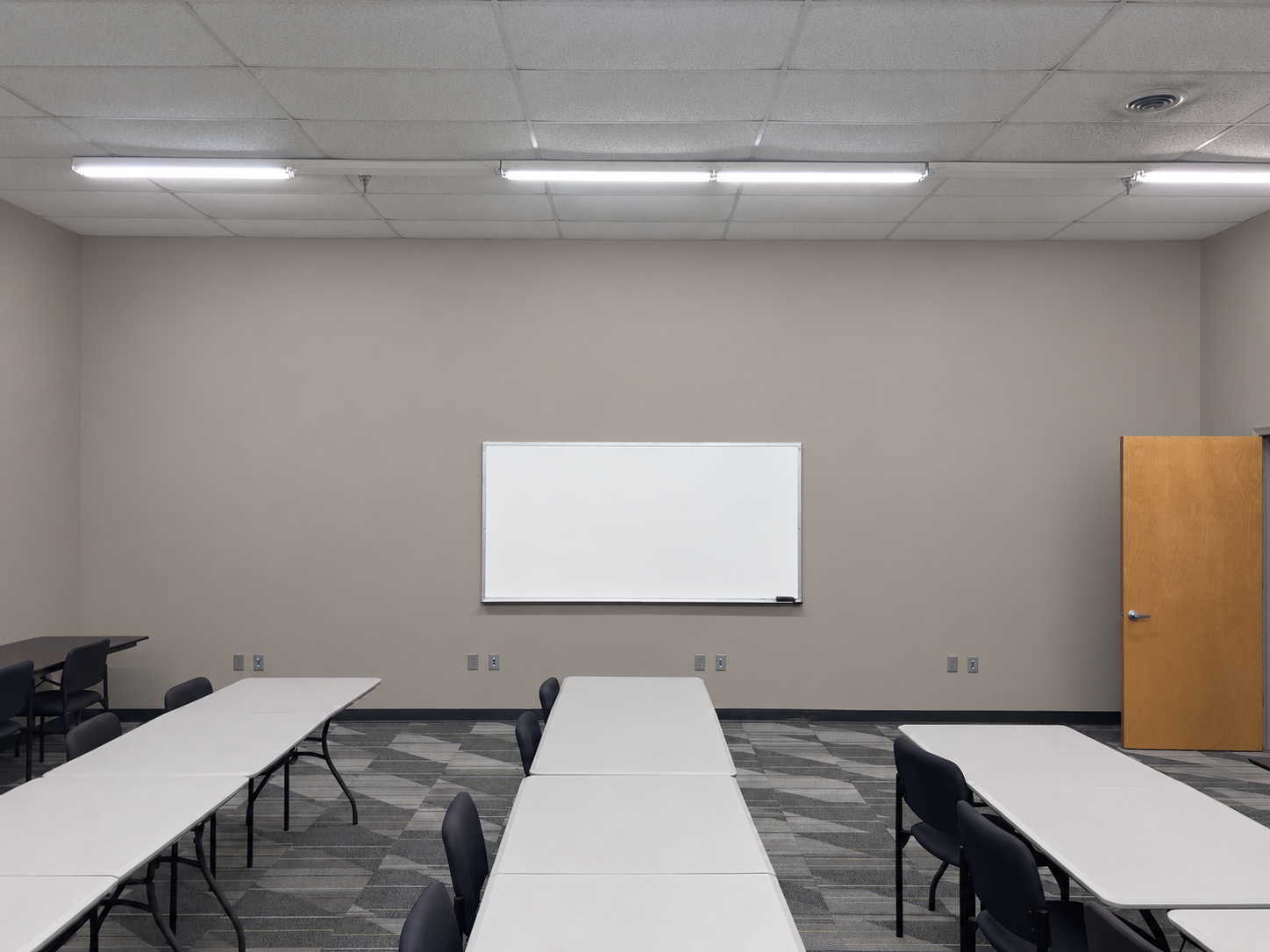Finished drywall and painted walls in a commercial classroom