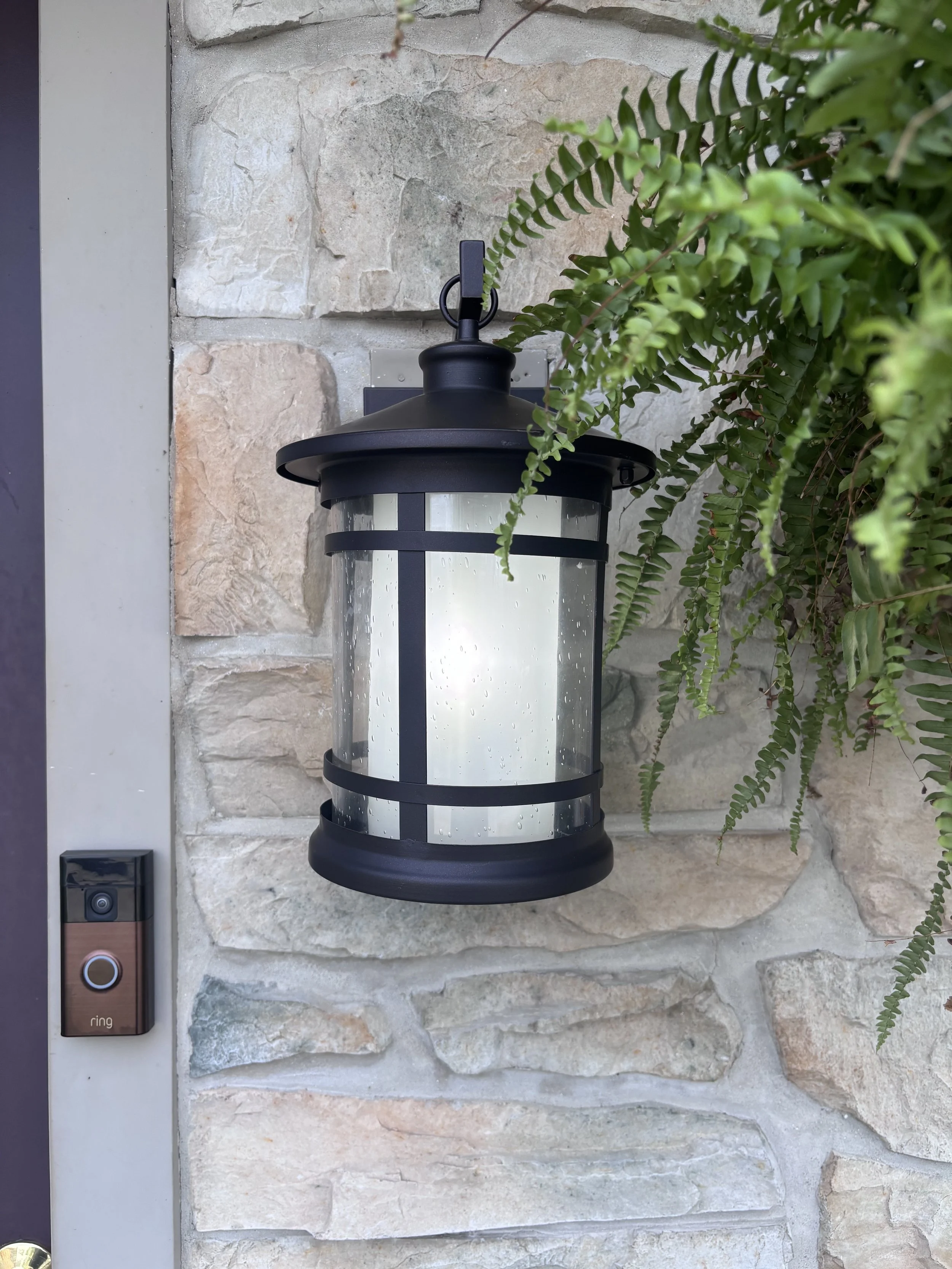 Exterior light fixture installed on a stone home in Lancaster, PA