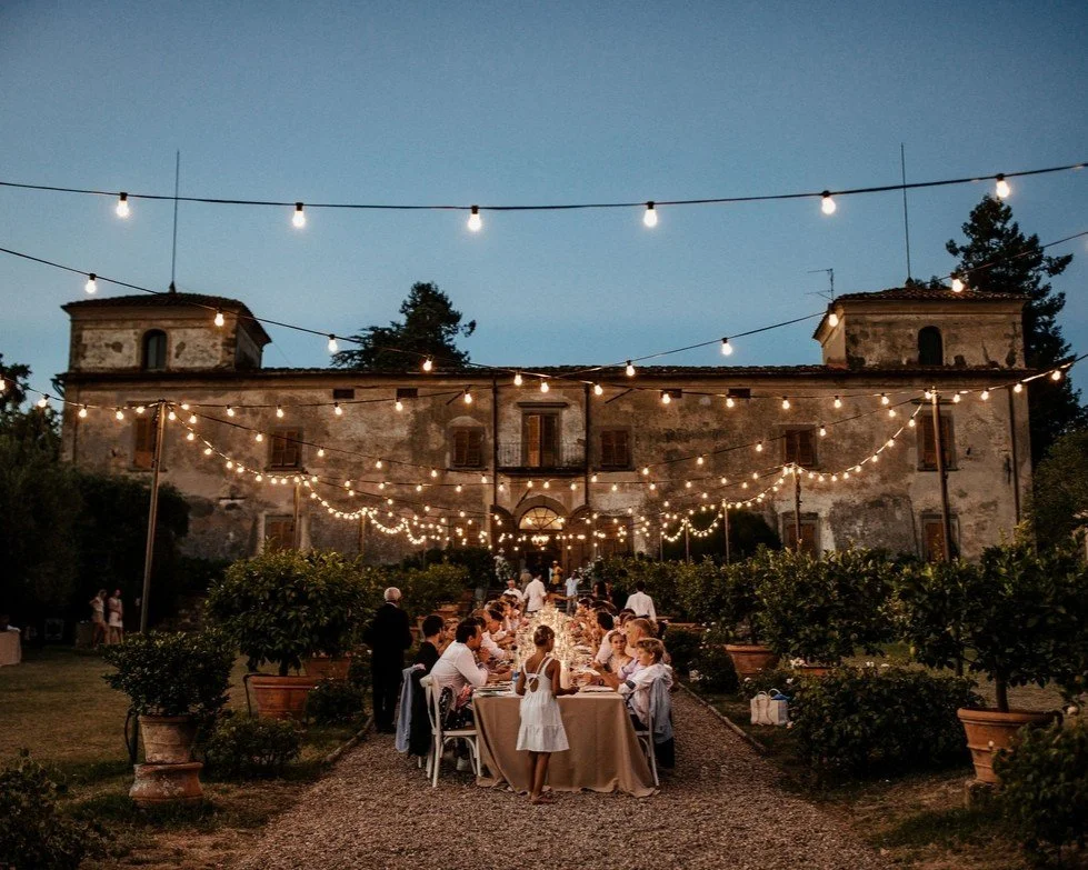 L&amp;D celebrated their wedding with an outdoor dinner in the heart of Tuscany &mdash; a long table, candlelight, and the kind of cozy atmosphere you only get in the countryside. Guests gathered under string lights as the sun set, enjoying good food