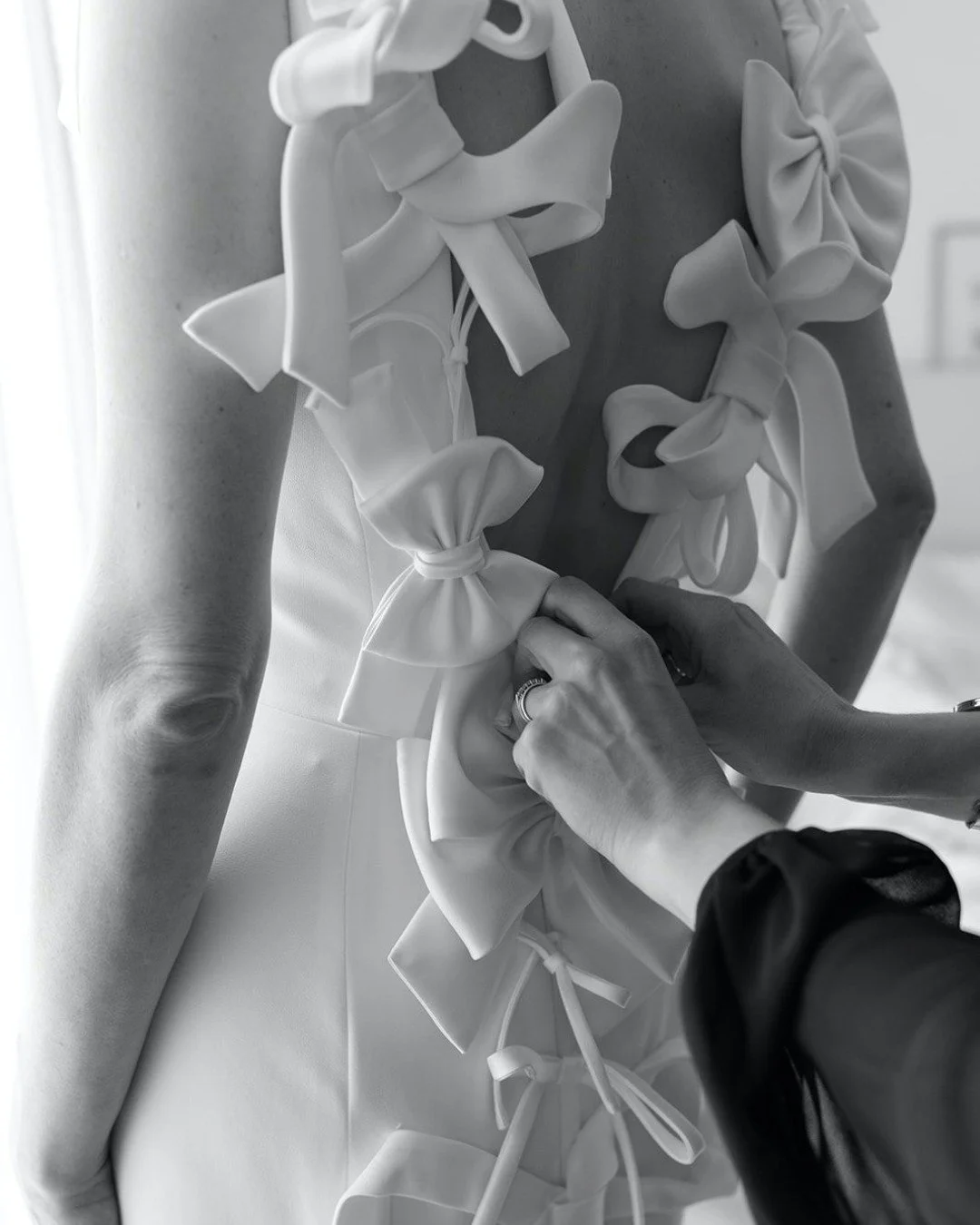 A moment for the dress.
For their wedding celebration a few weeks ago, E&amp;M chose this beautiful @viktorandrolfmariage gown with a clean silhouette, open back and dramatic bow detailing flowing down the train.
Quiet from the front, unforgettable f