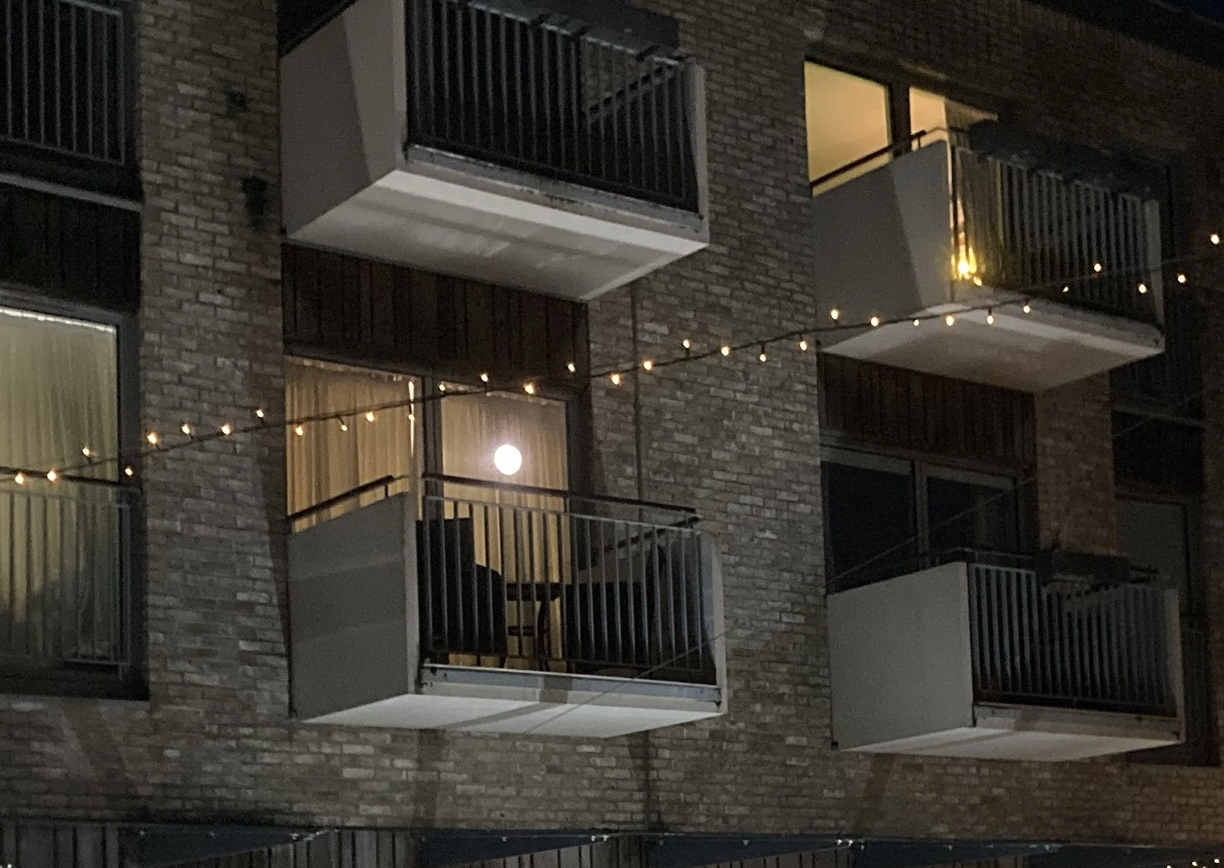  “Balconies in Strings of Light” — Sue Warren