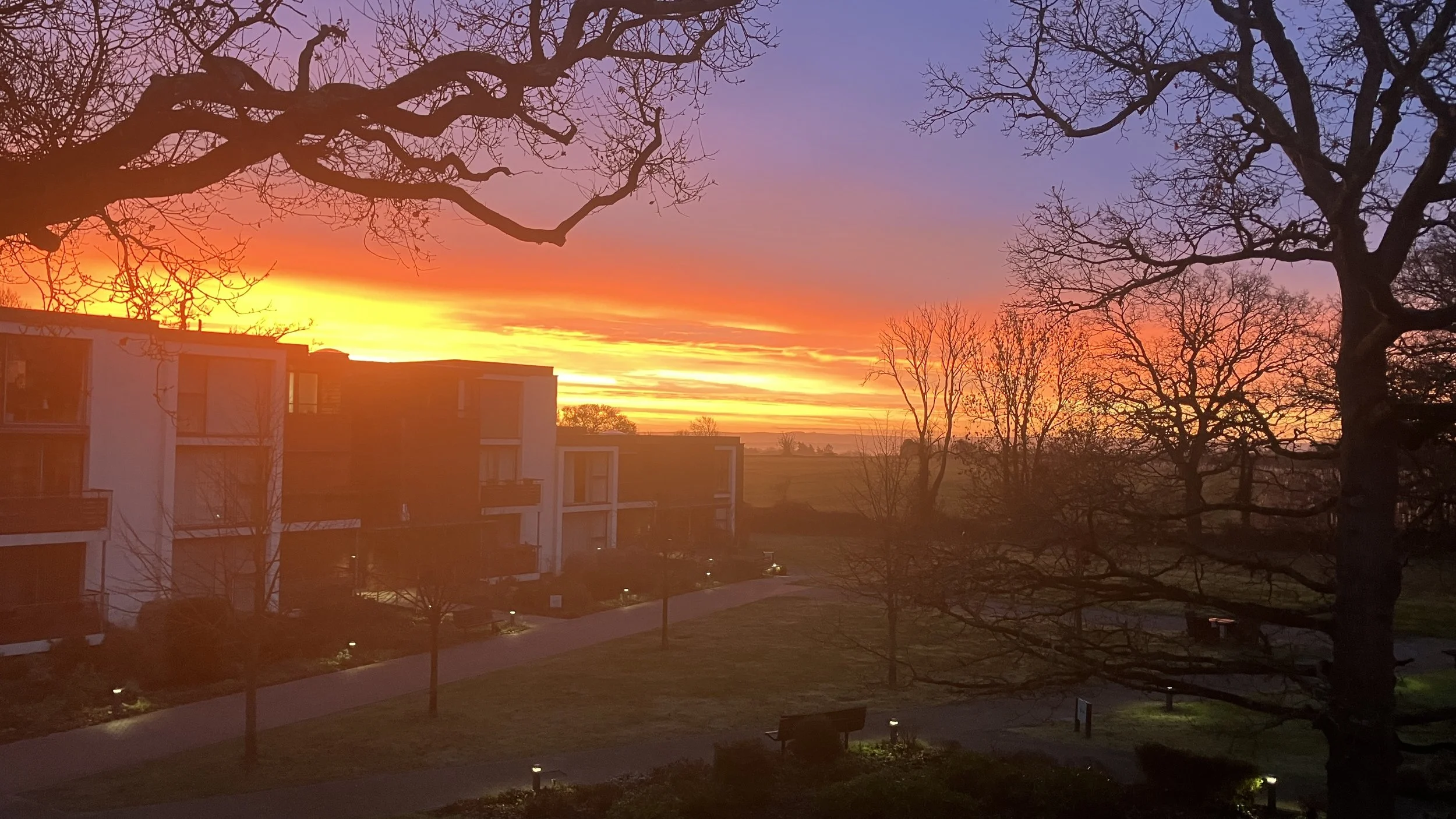 Norman – Low Winter Sun Between Buildings