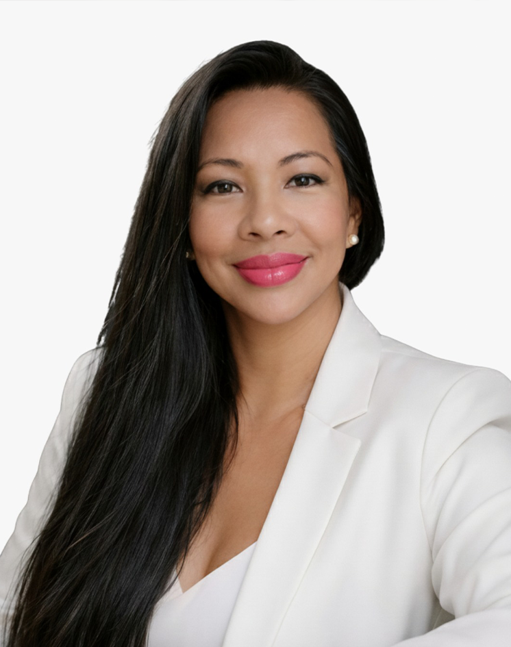 A woman with long black hair, wearing a white blazer, smiling, against a white background.