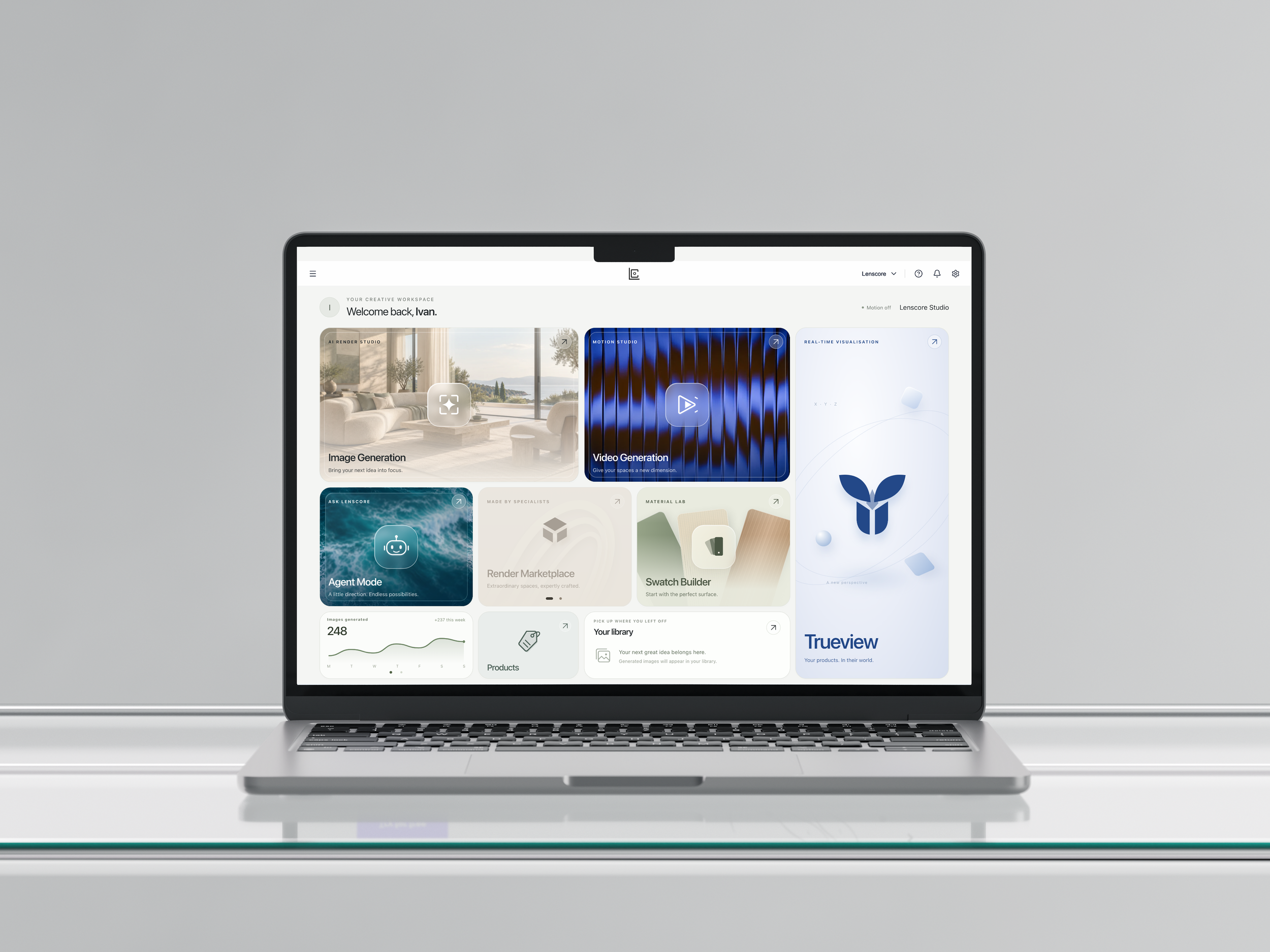 Lenscore Studio home dashboard on a front-facing MacBook, with the app logo, navigation menu, help, notifications and settings.