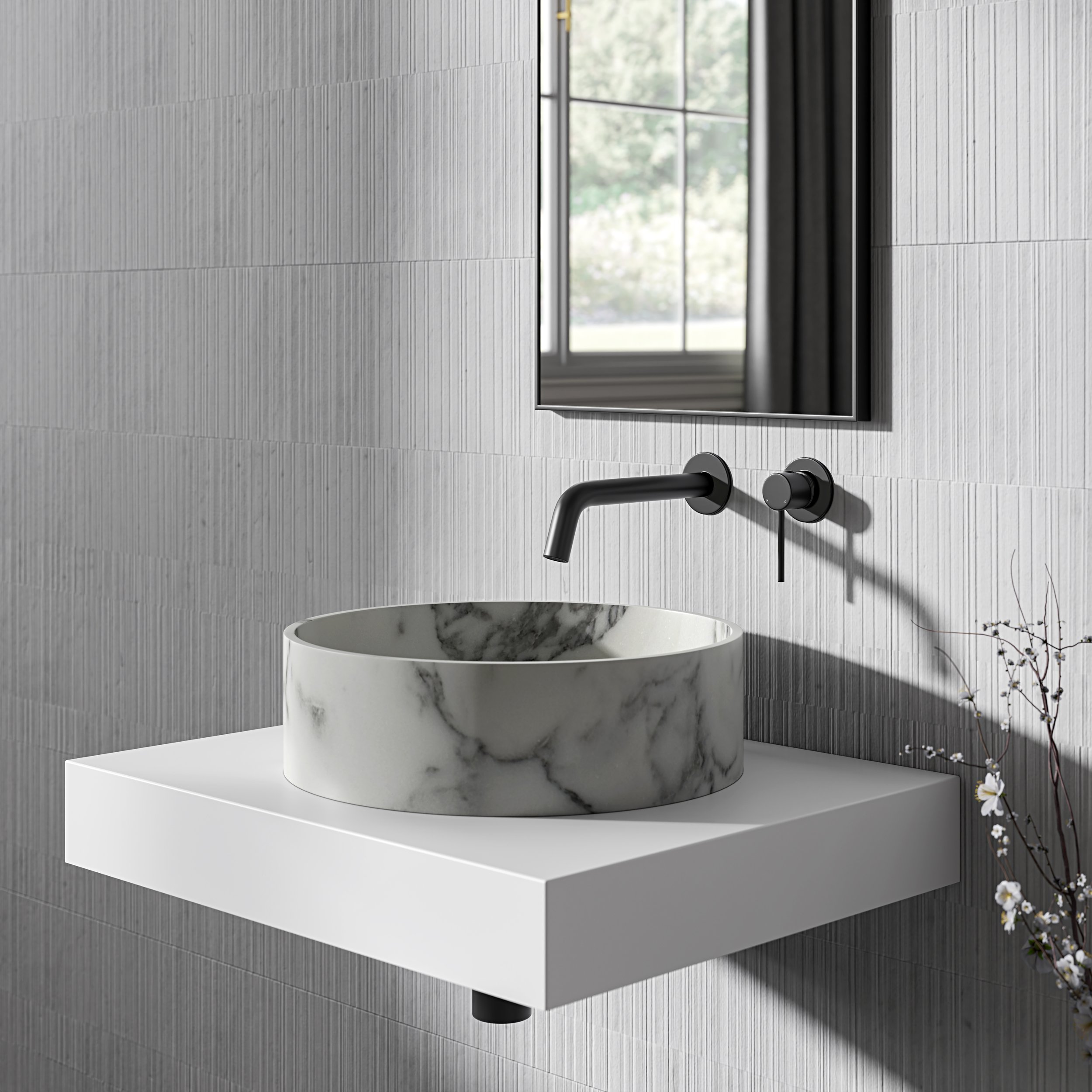 Minimalist floating vanity with a round marble vessel basin and matte black wall-mounted tap, set against vertical ribbed tiles and framed by a slimline mirror.